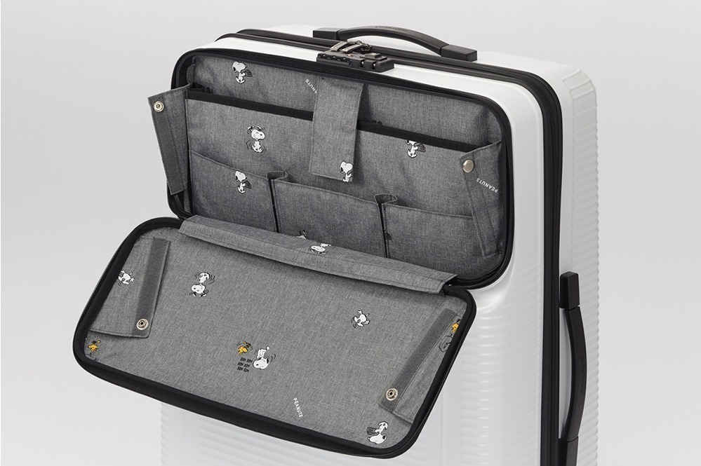 プロテカ ピーナッツの限定スーツケース 内装 カバーにスヌーピー ウッドストックの総柄プリント ファッションプレス